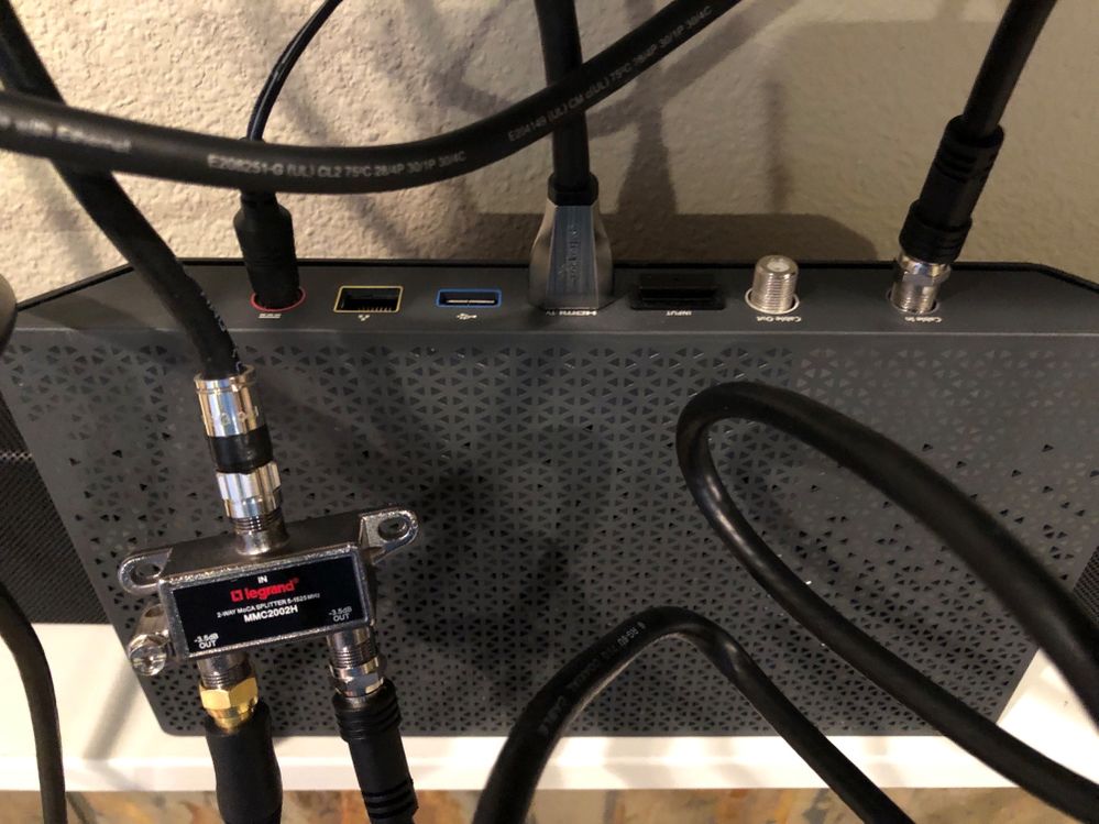 Gold Coax Goes Into White Wall Port In Next Photo. Silver Coax Goes Into Cable Box.